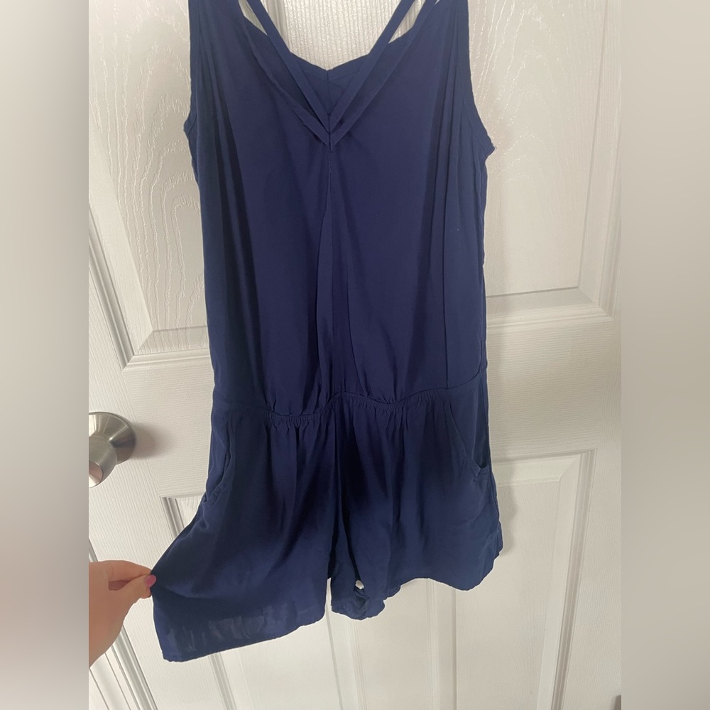 This is a navy blue size small romper by express.
